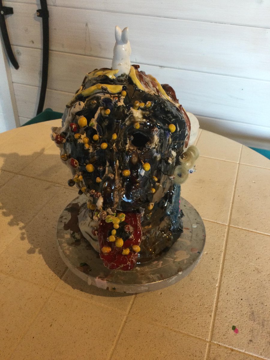 Covid by Jacqui James
This is a ceramic head hand made, hand glazed.
This head I made while in lockdown it’s made of clay and slip it has little metal sticks fired in the clay with tiny balls on top representing the virus. There is only one and it is impossible to be repeated.