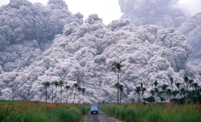 A car escaping the eruption of Mt. Pinatubo in the Philippines, 1991. Photo by Sir Albert Garcia/Manila Bulletin.
