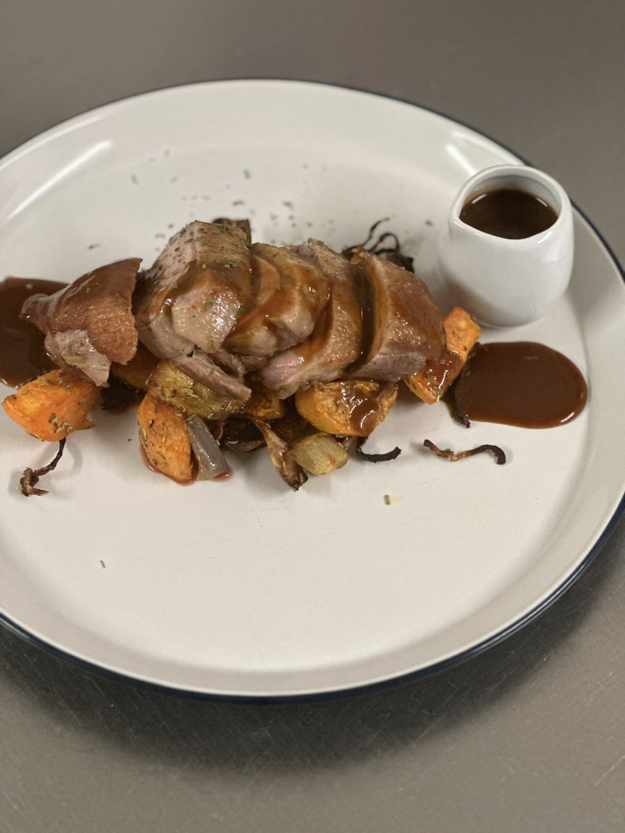 Pan fried duck breast on a bed of roasted sweet potato with rosemary and served with a hosin sauce
