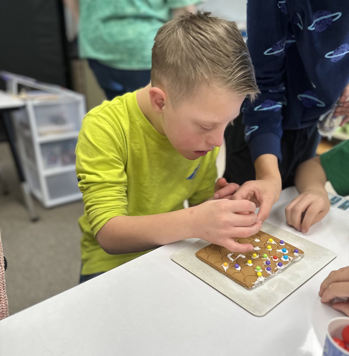 Our students had so much fun making gingerbread houses with their buddies!