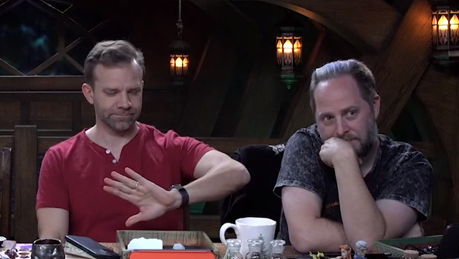 jamarish's tweet photo. This is so funny Liam just looks at his watch and I guess he decides it's cuddling Taliesin time? Nothing else seems to prompt it? They just reached hug your friend time? #CriticalRole https://t.co/iMOjFWVu64