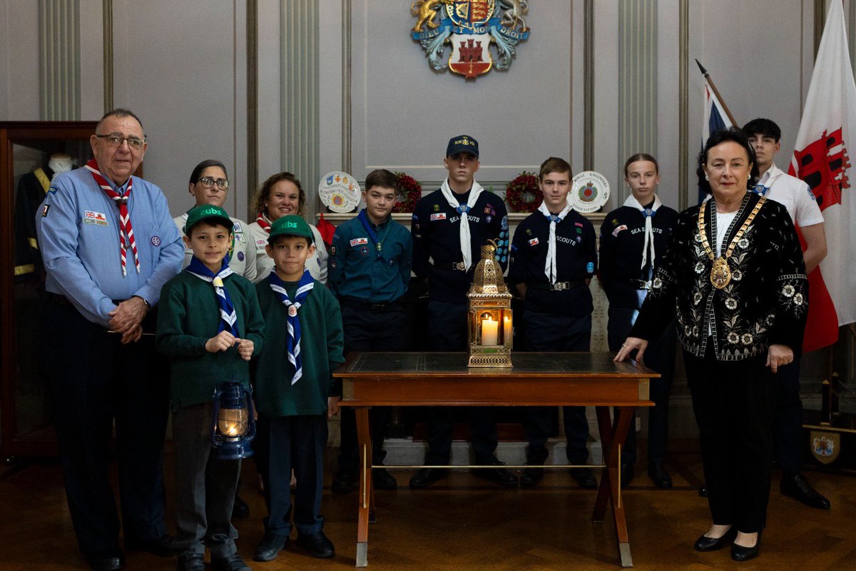 Her Worship the Mayor receives the Bethlehem Light of Peace from the Gibraltar Scout Movement