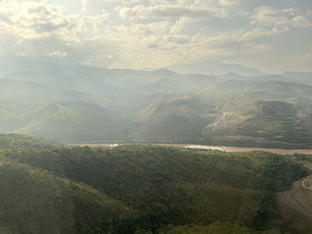 TayeAtske's tweet photo. Clouds are hovering above, The Gibe river is flowing through the majestic mountains of South West Ethiopia; thousands skilled workers and engineers are moving the earth building the Koyesha Hydro-Electric Dam, another Engineering marvel of #Ethiopia. There shall soon be light to our people in the South.Hope,perseverance and courage are moving Ethiopia forward.