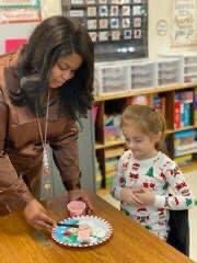 ParkwayTPSD's tweet photo. Christmas cookie decorating in Ms. Pointer’s class yesterday—members from the local AKA chapter came to help! 🍪💙💛🐼
#TPSD https://t.co/QfFIDqR1Hi
