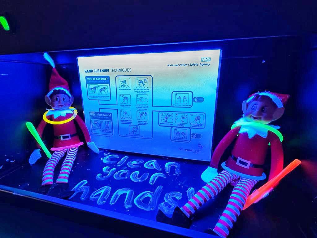Day 23! (Two more sleeps) The elves are having a rave which isn’t what I had in mind when I said we were using the glow box! Anyway they are learning the correct hand hygiene technique to make sure they remove as many organisms as possible! #IPC #infectioncontrol #handhygiene