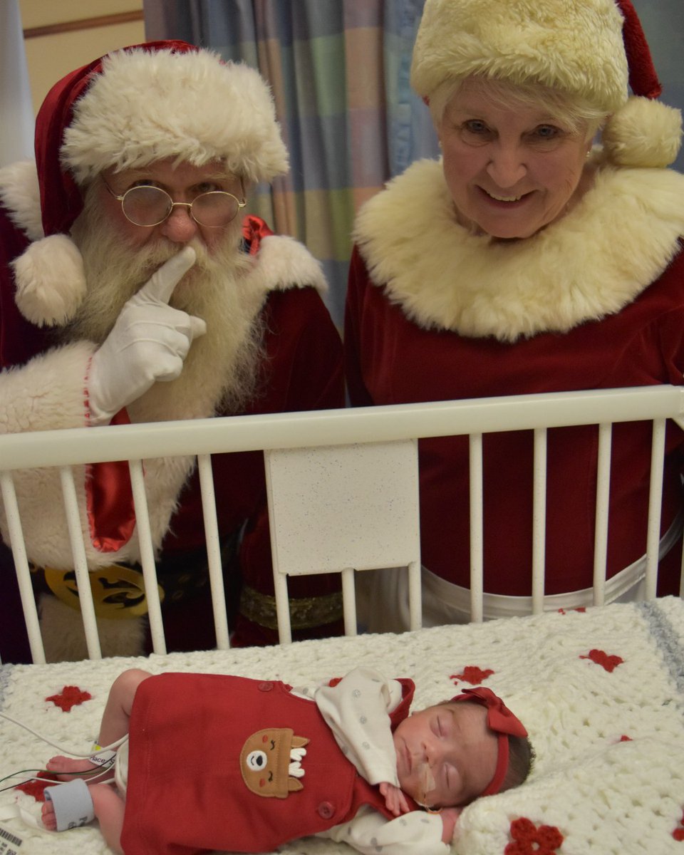 ✨ Tiny tots with eyes all aglow, making the holidays extra merry and bright! 🎄👶 Our RNICU infants had a special visitor come to town early! #HappyHolidays! NOTE: UAB supports “Back-to-Sleep,” and these infants were monitored during the photoshoot.