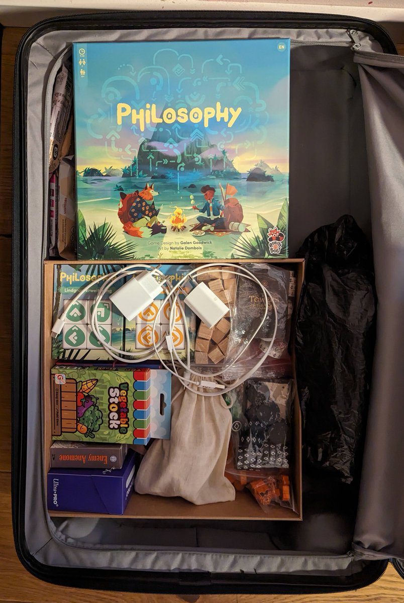 dilkROM's tweet photo. Half of my travel bag to go see the in-laws for the holidays. Hard to see but that's a @TowersOfTheSun prototype under the other items in the lower half.

Notable mentions: @dnlnwmn's EnemyAnemone and @yelmelnobrainer's Tall Tales hidden under @TaiwanBGdesign's Vegetable Stock. https://t.co/Ak2gjhr6J9