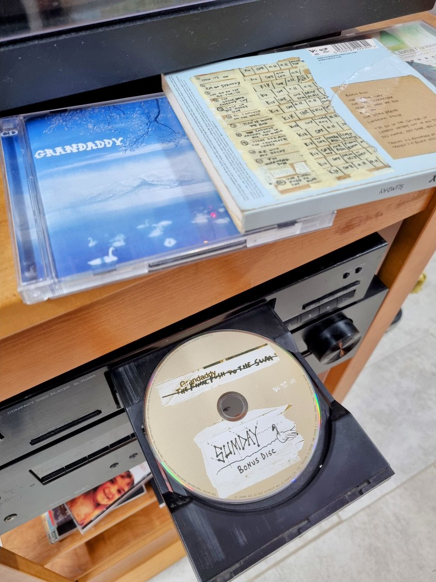 david_crawshaw's tweet photo. Got our old CDs from the loft, the kids are listening to the #Sumday bonus disk for the first time which contains (imo) hands down the best version of "He's simple he's dumb he's the pilot"
They are already huge @Grandaddy fans, but this feels special. https://t.co/K3kLqaKnio