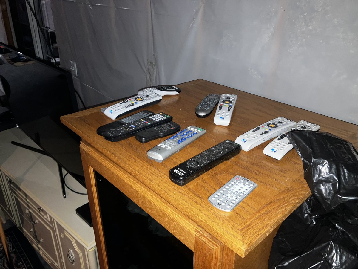 BayerJeff's tweet image. The remotes that are out next to the basement TV at my mom’s house. Whatever the contest is, I won right?