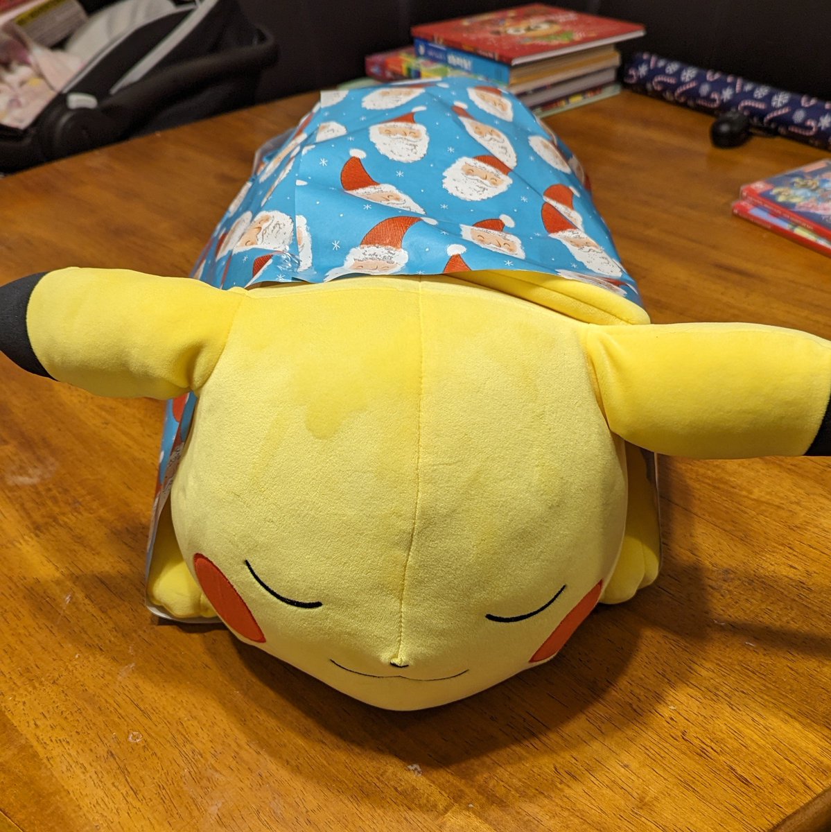 Our son is going to find Pikachu sleeping under the tree in his wrapping paper blanket on Christmas morning. 🥰