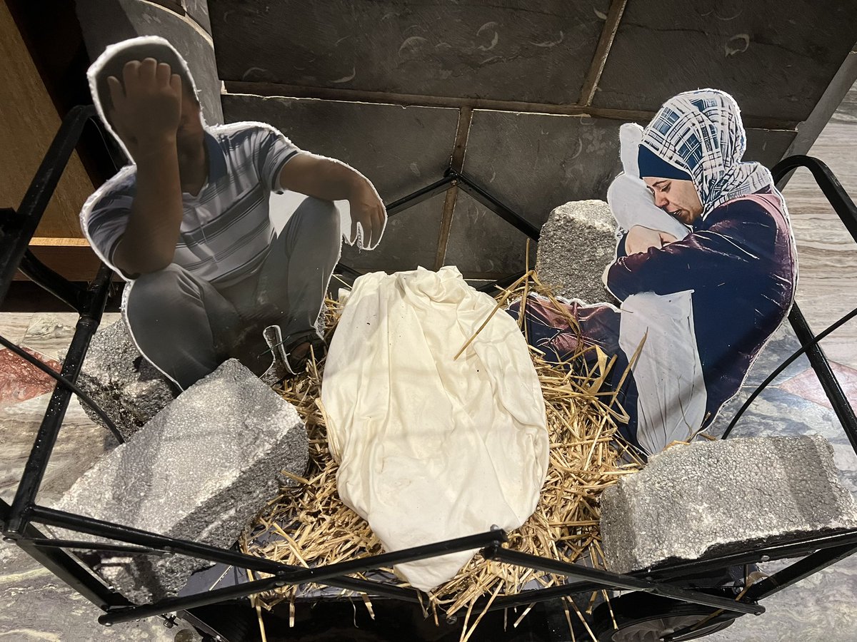 ciarantierney's tweet photo. This poignant crib was unveiled at a solidarity vigil for #Palestine in #Galway yesterday.

It honours the thousands of innocent civilians who were murdered by #Israel in #Gaza in recent weeks. Currently on display at Galway Cathedral for #Christmas 

#GazaGenocide https://t.co/78u7qzHEUw