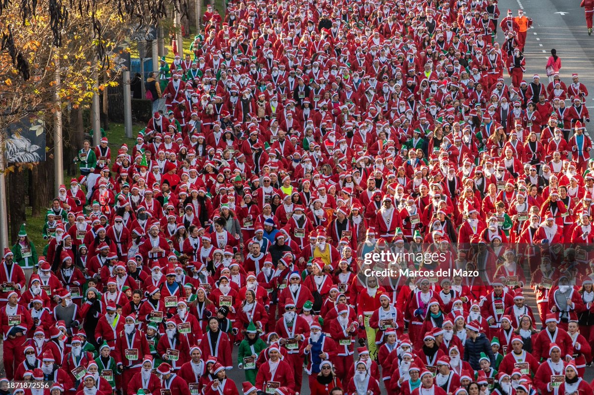 Thousands of people dressed as #SantaClaus running during the annual Santa Claus #Christmas race