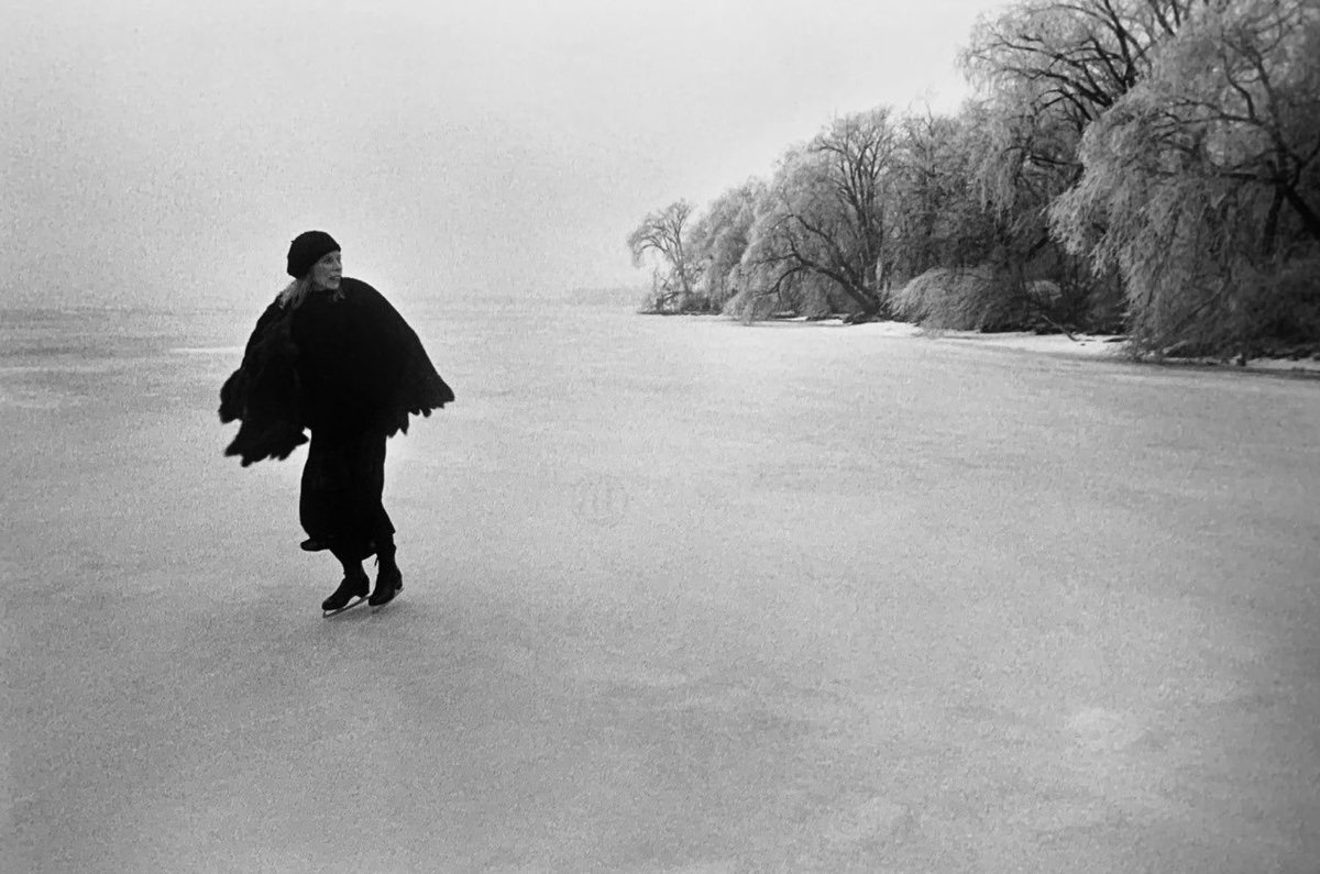 Joni Mitchell skating on frozen Lake Mendota, Madison, Wisconsin, March 1976. Photos by Joel Bernstein.