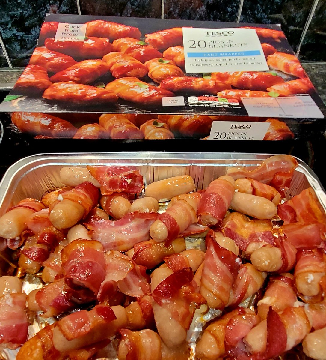 Cooking trays of pigs in blankets ready for Stacey to take to work tomorrow, Christmas Day, for the doggies in Cardiff @DogsTrust 🐕🐶 #adogisforlife #AdoptDontShop