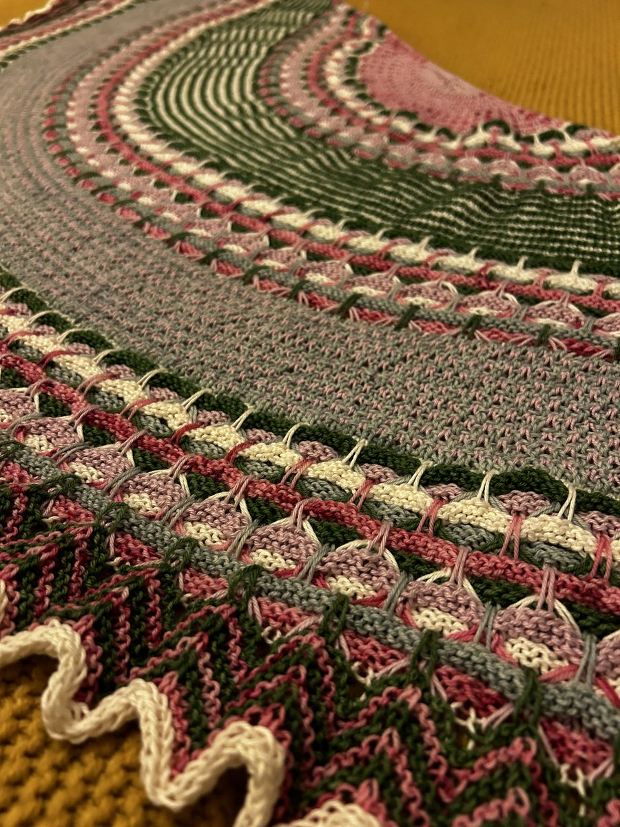 KnitWit78's tweet photo. Oof! This took ages! Still need to block, so it will grow a bit more. Westknits Aurora Cabin Shawl, with a mixture of Birdstreet Yarn 4 Ply and Rowan Summerlite 4 Ply. 

And now for a glass of something fizzy! Merry Christmas if you’re celebrating tomorrow. #knittingtwitter https://t.co/PC4utF9UJc