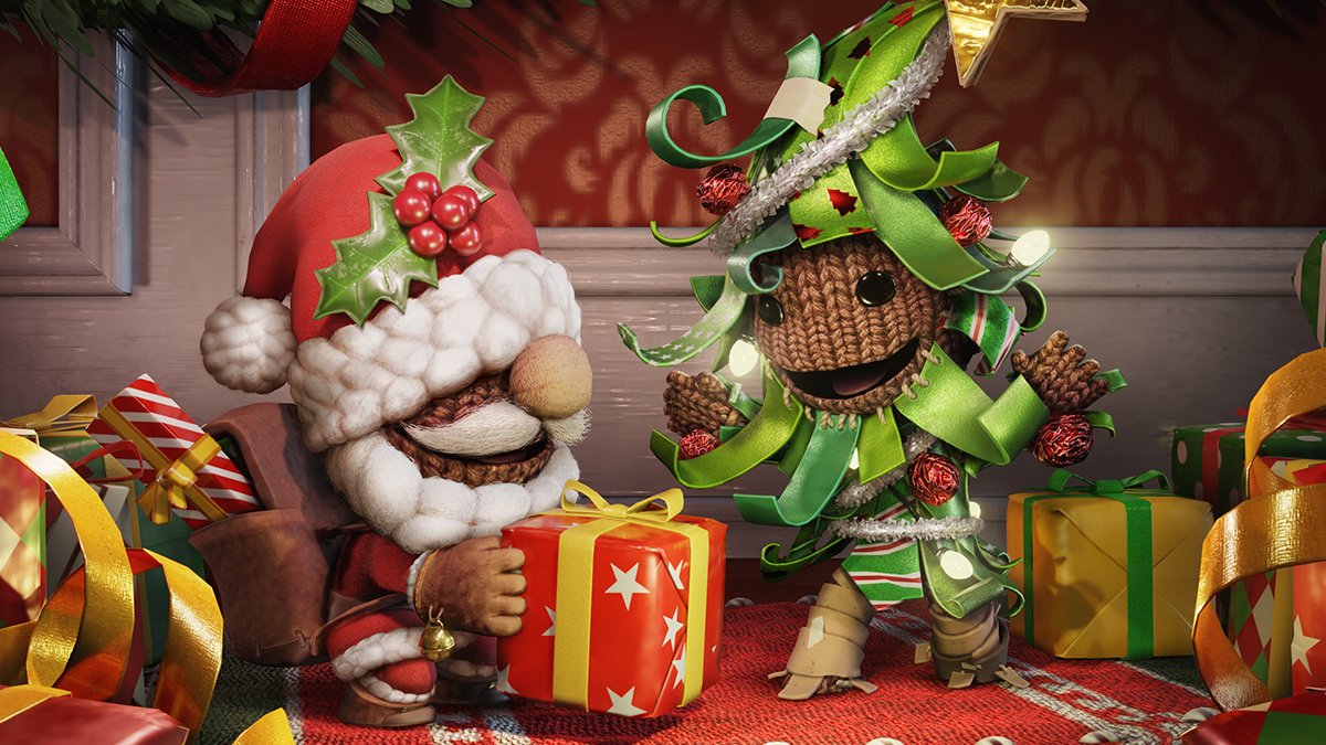 Promotional art of Sackboy wearing a santa suit and a chrstmas tree outfit