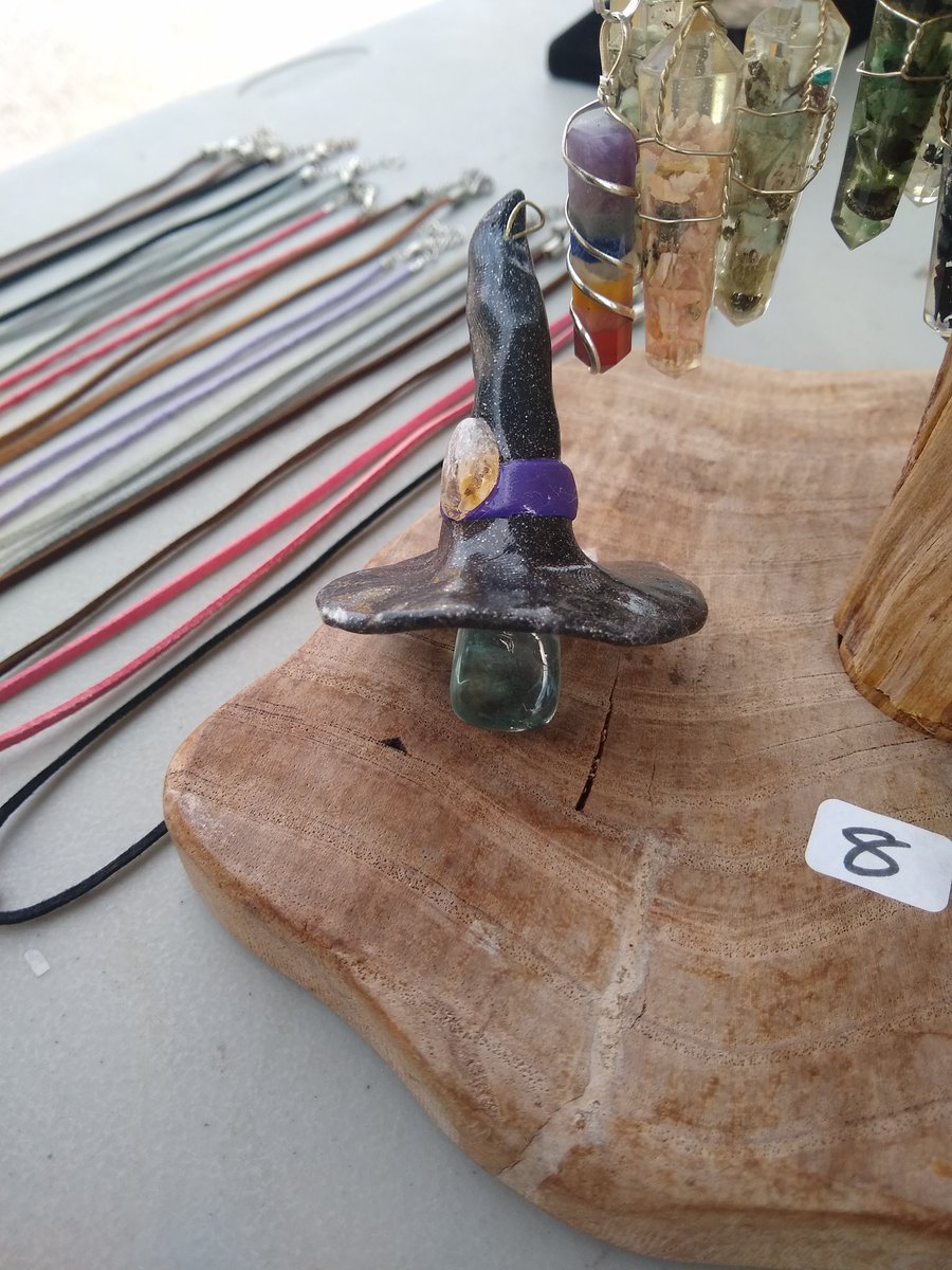 sandwohch when the sand is uhh heated ti 3090° F and then mixxed with dyea and picments abd shaped into a ball, them placed under a firef clay hat decorated witj a buckle and glazed. and then the witch. i.