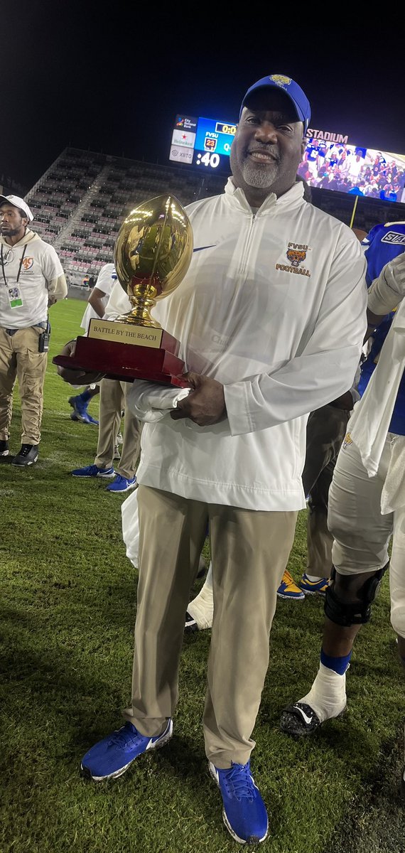 Kwray54's tweet photo. Like Father Like Son! We both holding up Bowl Championship Trophies for 2023. Florida Beach Bowl Champ and Famous Idaho Potato Bowl Champ. Let’s Gooooo! #WildcatPride #PantherPride #RayMen https://t.co/ooOUHA4Z2G