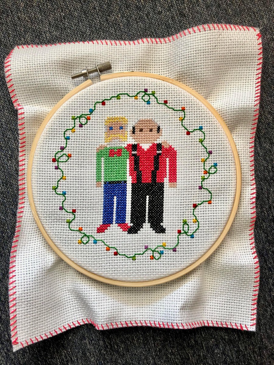 Merry Christmas to you all. This is the front of the card @wardqnormal.bsky.social made for our friends this year. It's real cross-stitch, no Photoshop or AI involved. We're rarely here since Elon; join us at Bluesky and Threads. May you have a year full of joy and good health.