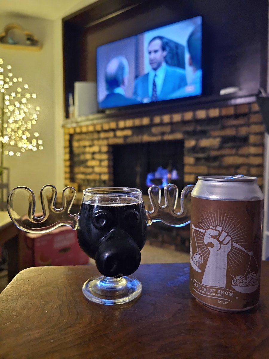 Wife next to me, fire in the fire hole, @darkhorsebrewco Plead the 5th S'mores in the best glass, and Christmas Vacation on the movin picture box. It's a good, good night.