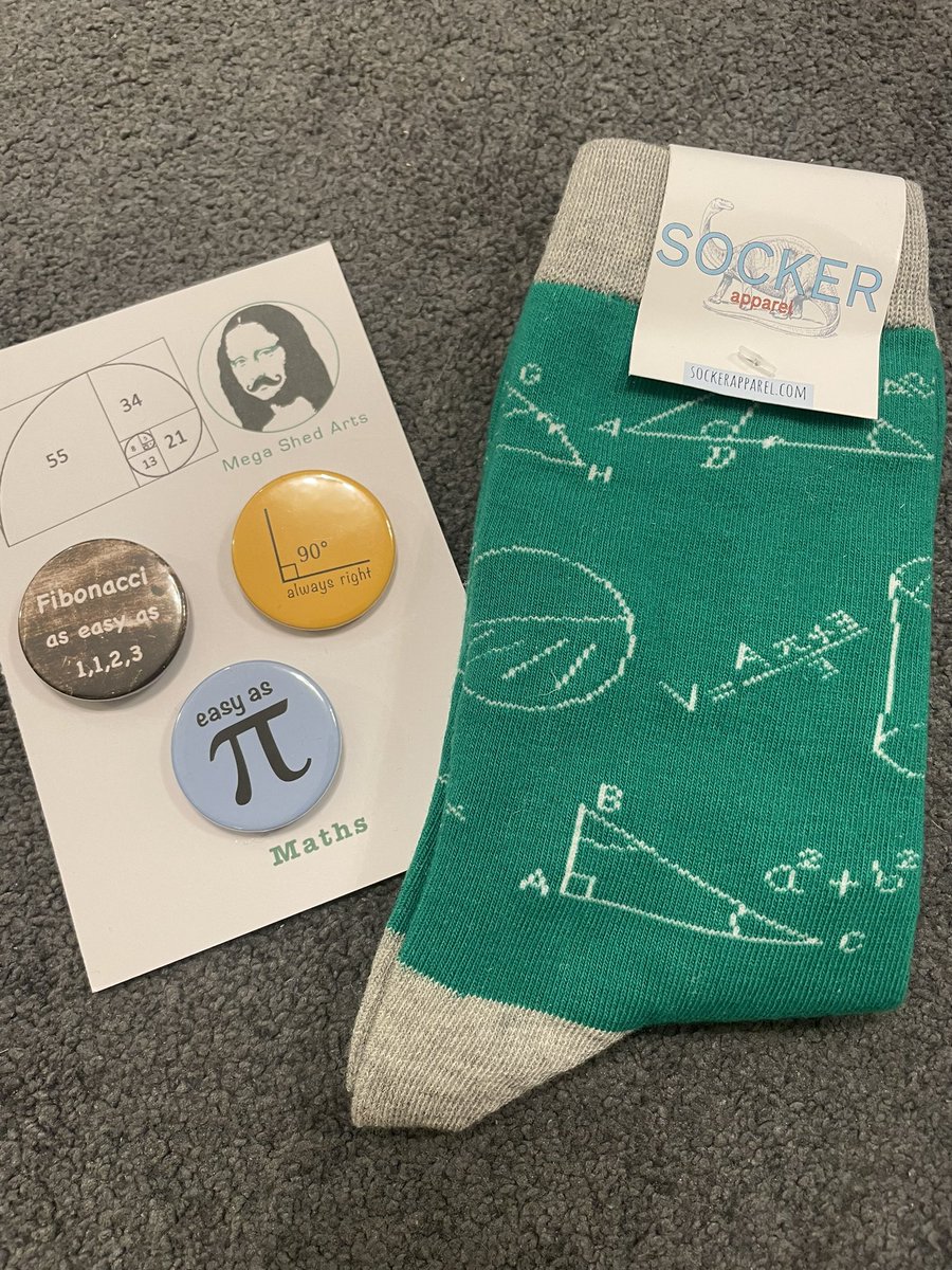 mathsjem's tweet image. Annual tweet of my maths-related Christmas presents! This year: badges, socks and book (which I’m very much looking forward to reading!). 👍🎁🎄
