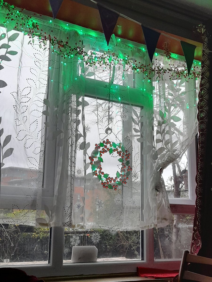 drtempledragon's tweet photo. #JoinIn the delicate lights and glass holly window decorations. https://t.co/G5vgMkeS7u