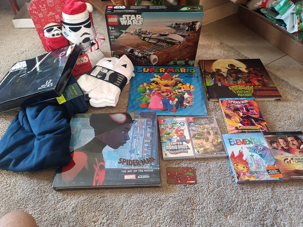 NathanB74243481's tweet image. Here are the presents I got for Christmas today:

Super Mario Bros Wonder
DreamWorks All Star Kart Racing
Across the Spider-Verse Blu-ray
Elemental Blu-ray
Gran Turismo 4K
Subway gift card
Lego Mandalorian ship
Into the Spider-Verse art book
Mutant Mayhem art book

(1/2)