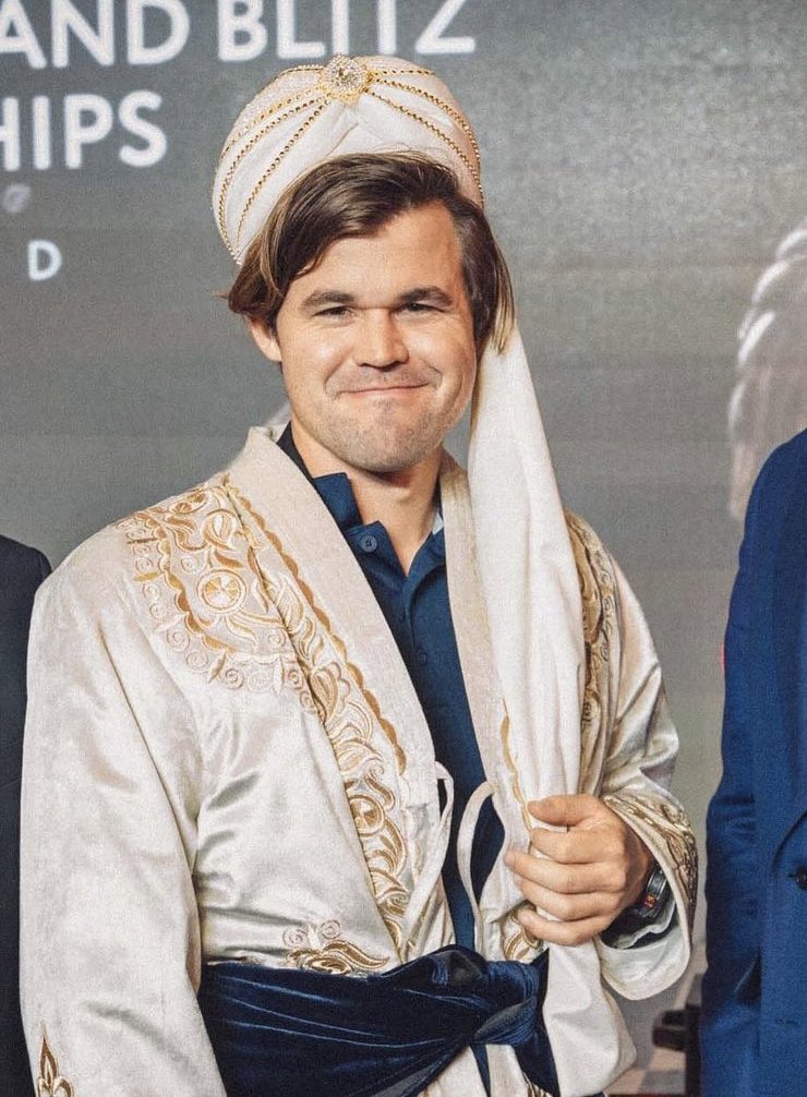 GothamChess's tweet image. Magnus Carlsen in traditional clothing for World Chess Championships in Uzbekistan 🔥