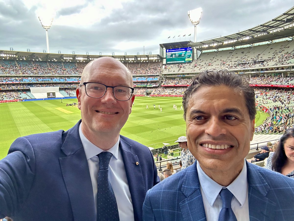 I enjoyed a half-day of cricket and conversation with ⁦@FareedZakaria⁩ at the Boxing Day Test today. You can see the cricketers behind us walking off the ⁦@MCG⁩ when rain stopped play.