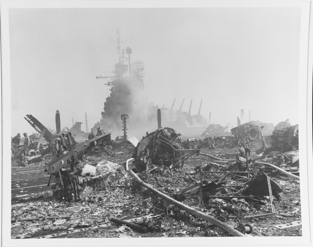 USS Bunker Hill (CV 17) - Aircraft wreckage on the flight deck, after most fires were out following hits by two Kamikazes off Okinawa, 11 May 1945. 

[4K] 80-G-259904 #CV17 #USSBunkerHill