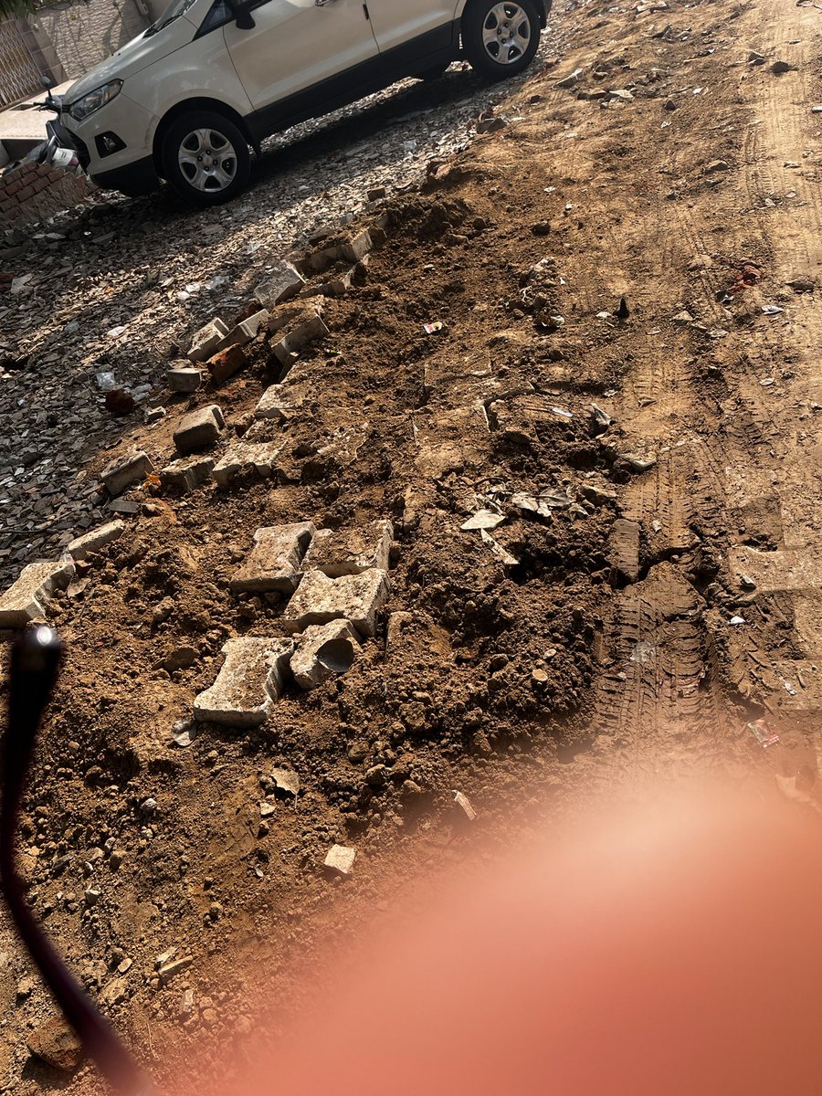 preetiand's tweet photo. @airtelindia @airtelnews @Airtel_Presence 
Your company has done a very bad job while laying down new lines in Vibhavnagar Agra 
They have uprooted all tiles on the sidewalk and left the path muddy with tiles thrown here and there
Kindly do the needful and get the path repaired. https://t.co/rguekXNLSC