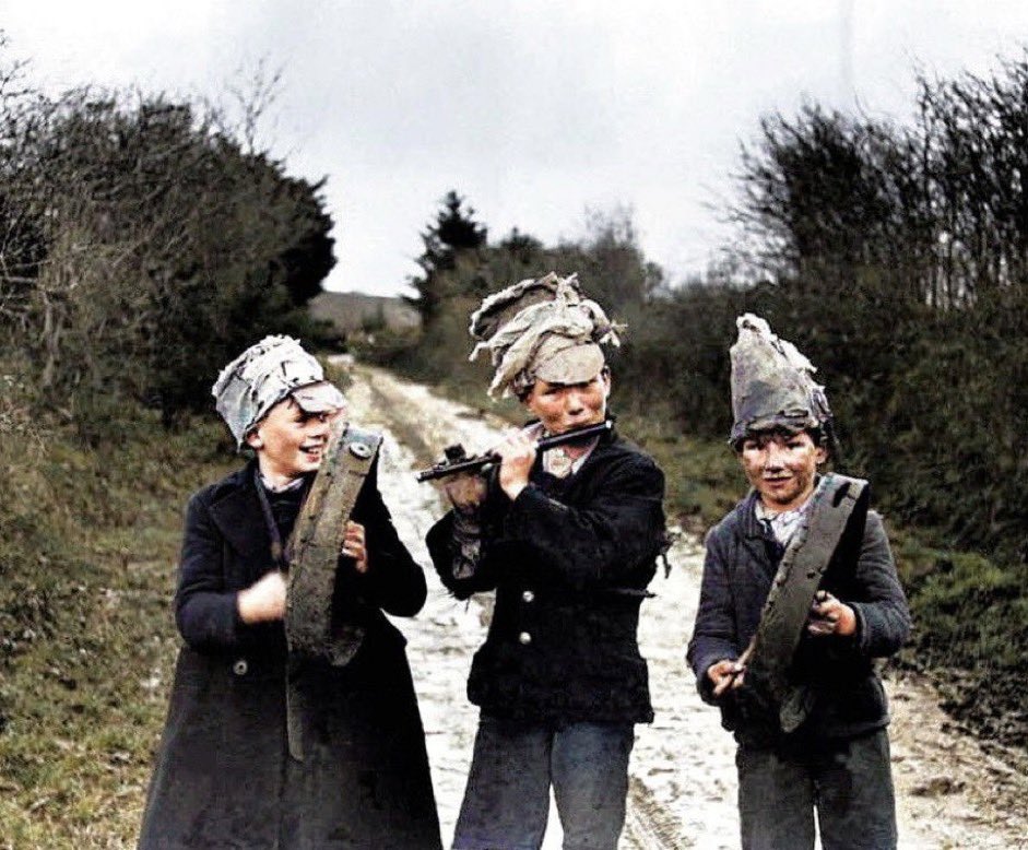 Wren Boys, Athea, Co. #Limerick by Kevin Danaher, 1947. #WestLimerick #StStephensDay  “The wren, the wren, the king of all birds, St. Stephen's Day was caught in the furze....Up with the kettle and down with the pan, And give us a penny to bury the wren.”#wrenboys #wrenday