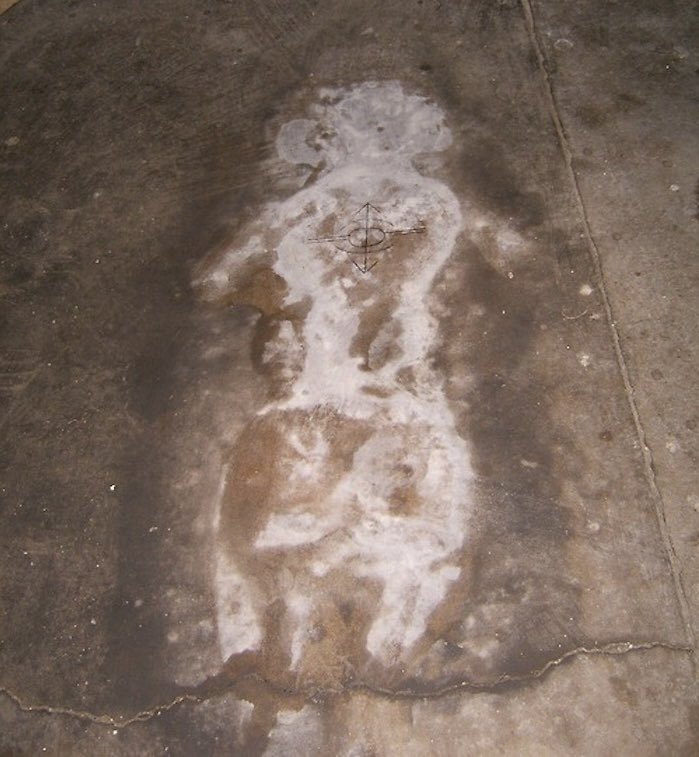 This is a stain left in a lunatic asylum by a woman called Margaret Schilling in 1978. Numerous efforts to eliminate the stain have proven unsuccessful. It is still there to this day.