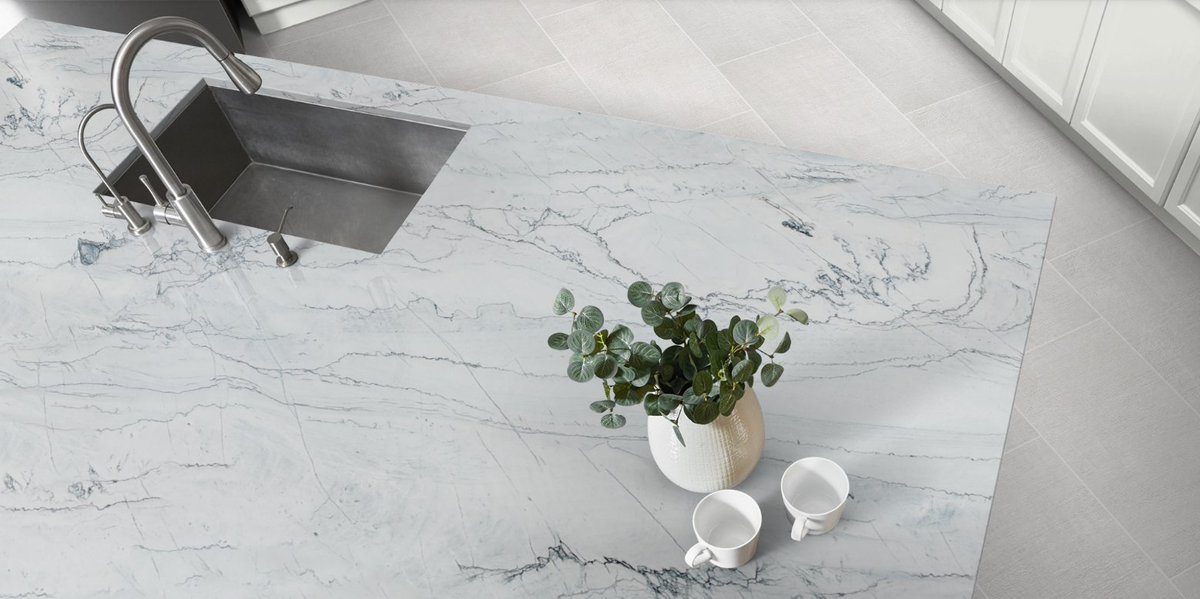 A colorful quartzite like Artemis can create a striking kitchen for any home. This grey quartzite will have darker grey veining along lighter grey movement that pairs beautifully with our Fragment White porcelain. Click here to learn more: ecs.page.link/qeUJp

#arizonatile