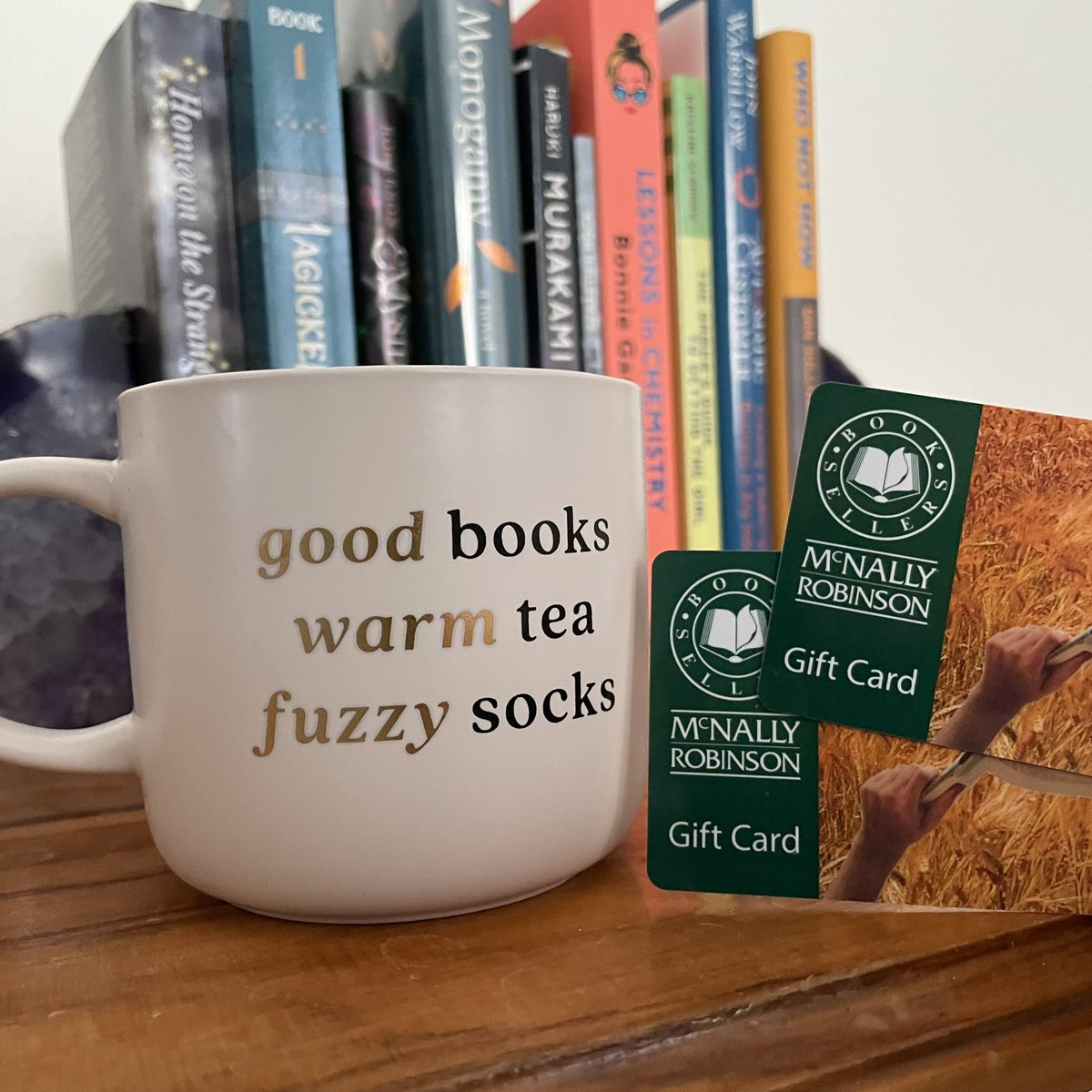 My family gets me! Christmas presents included a “Bookish” sweater from @stoonlibrary, reading socks, @McNallySK gift cards, tea, and this perfect mug! All cozied up, I finished Crow Mary by Kathleen Grissom - which I highly recommend! #amreading