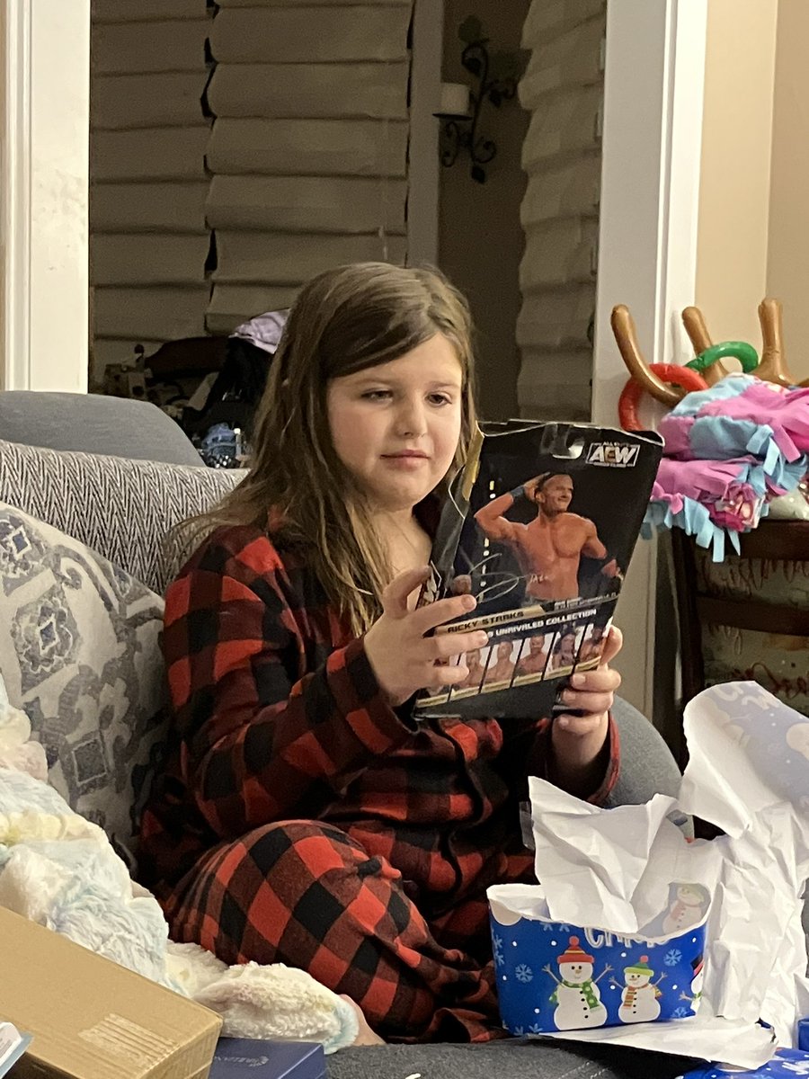 LetTheBeardPlay's tweet photo. The excitement my daughter showed while getting her @starkmanjones #AEW action figure for Christmas was absolute! 

This is the one she’s been waiting to get for a while. https://t.co/T2dHoCbjDJ