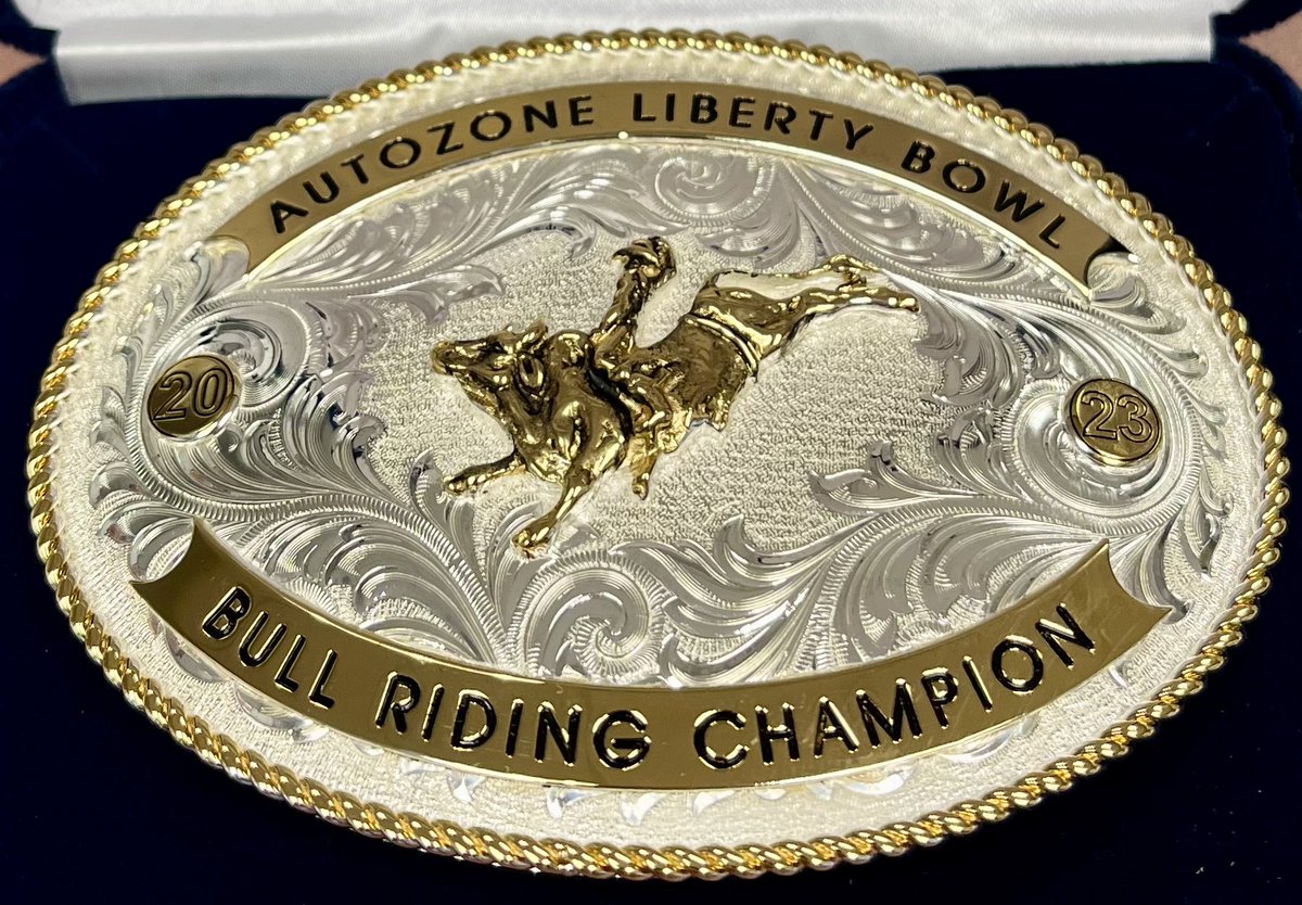 AZOLibertyBowl's tweet photo. Congratulations to Levi Daughtry from Millington, TN,  winner of the Inaugural @AutoZone Liberty Bowl Bull Riding Challenge at tonight’s Pro Rodeo. He received this custom belt buckle for his win! 🏆 https://t.co/pSwK7TxgVa