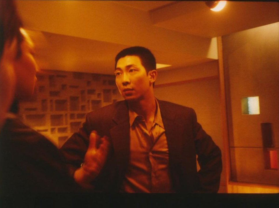 whooperjin's tweet photo. giving 90s hong kong cinema detective debriefing his subordinates about the plan to capture the boss of a cartel only for the film to dramatically end up revealing that he is the head of the underground business and that he’s been purposely leading around in a fruitless chase https://t.co/sORjPIeayy