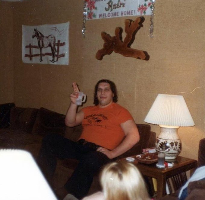 André the Giant hanging out and smoking a cigar with some wonderful  equestrian themed art
