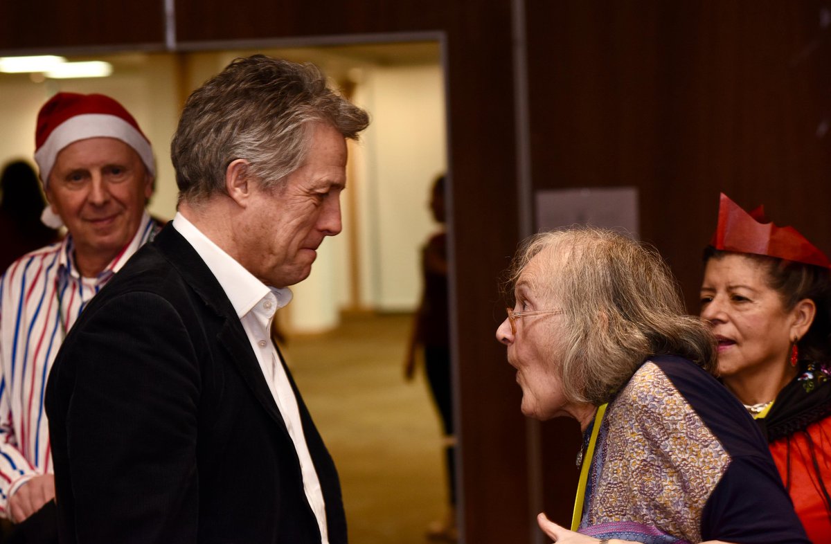 Actor Hugh Grant helps serve Christmas lunch to 500 older residents at our annual lunch.