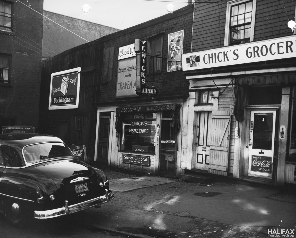 hfxgov's tweet photo. On the third day of Archives, the closest #hfxarchives could find to three French hens is one photo of Chick's Lunch and Grocery on George St., from around 1962. This photo was taken shortly after the shop had a fire that caused extensive damage inside. #12DaysofArchives https://t.co/Gmg3XwsxBT