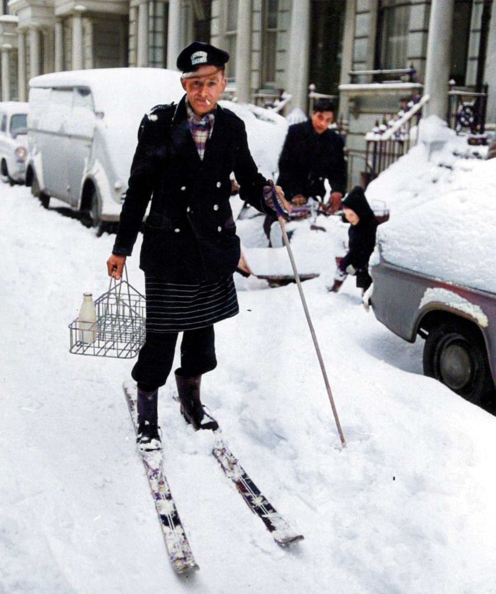 A milkman working in the snow in Earl's Court, London, 1963. #milkman #the60s #thesixties #earlscourt #londonsnow #colourised