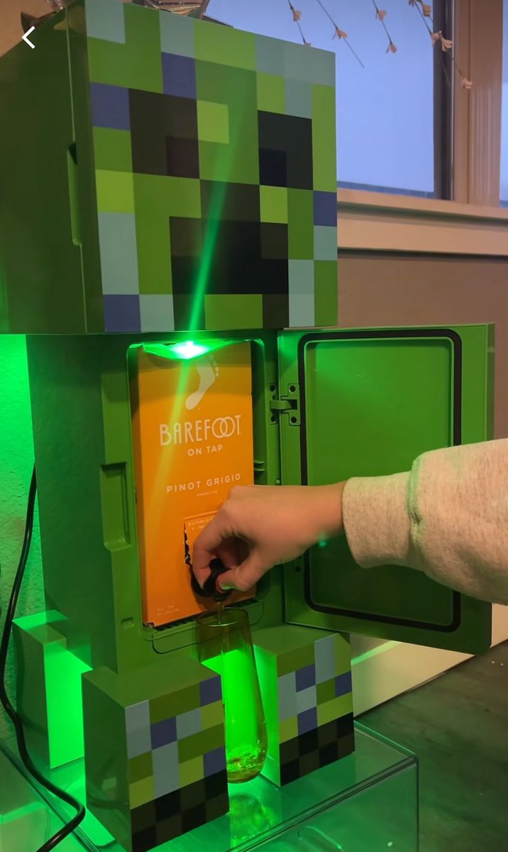 creeper mini fridge with box of barefoot wine in it