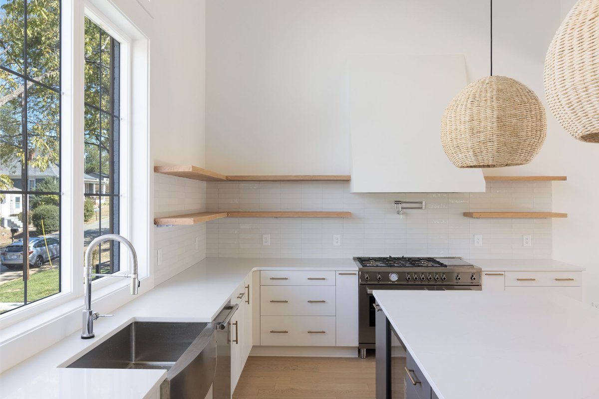 Elevate your culinary experience in our all-white kitchen, where elegance meets comfort . The white palette, sloping range hood, and sparkling backsplash make for a clean and sophisticated feel. #thesoulfulhome #nashvilleinteriordesigner #newkitchen' #newkitchen #kitchendesign