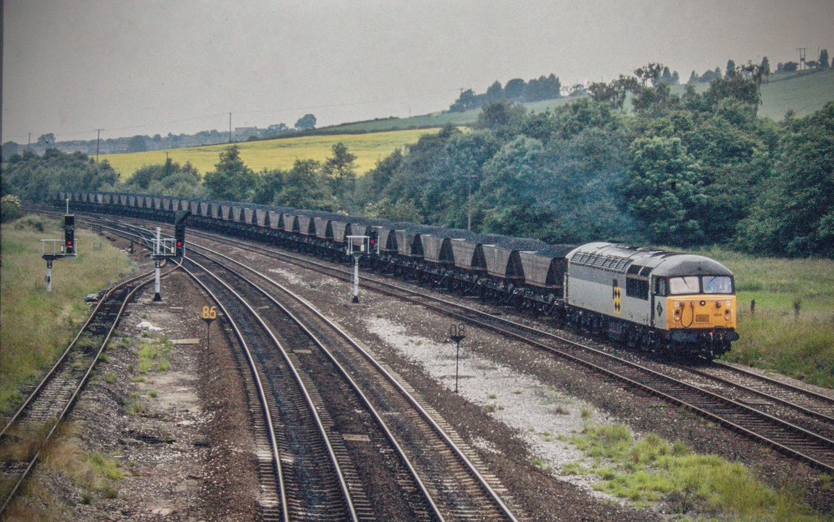 Romanian built 56005 powers south across Clay Cross junction and heads down the Erewash line with a fully loaded MGR train. The loco was sadly recycled at Booths in Rotherham in 1996. #Class56 #Grid #RailfreightCoal #ClayCross #Trainspotting