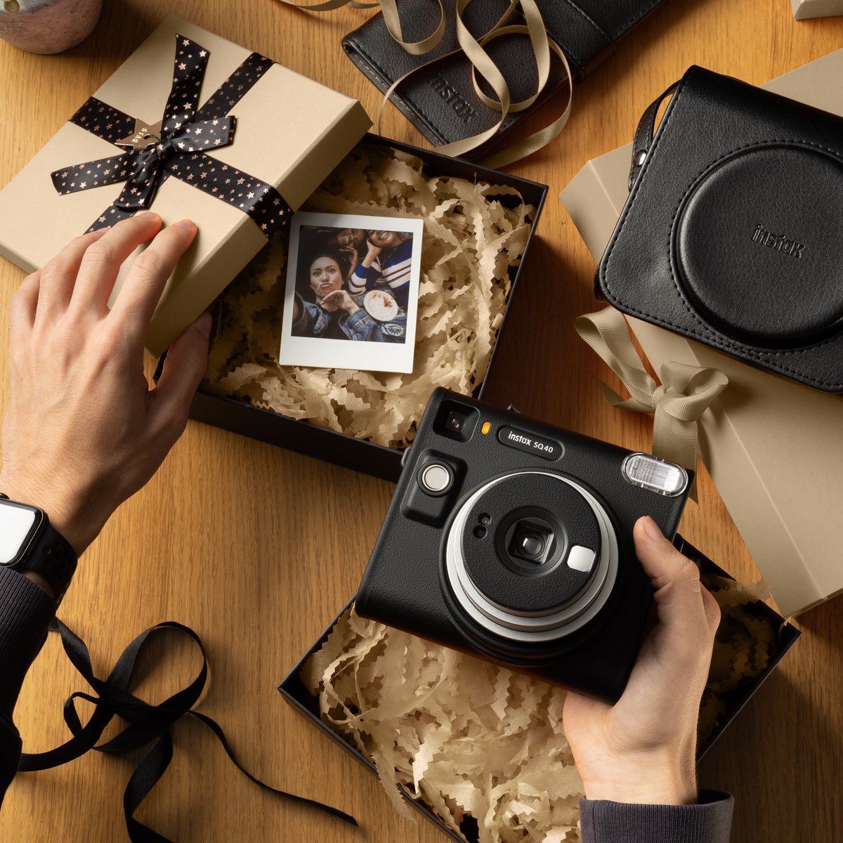 Surprise 'em with a square! 🎁 Gift a moment from the SQ 40, boxed up in holiday magic. 🌟 #SQ40 #instax #instaxindia #instantcamera #camera #memories #moments #instantfilm #instantprints #instaxmemories #capturethemoment #newyears2024