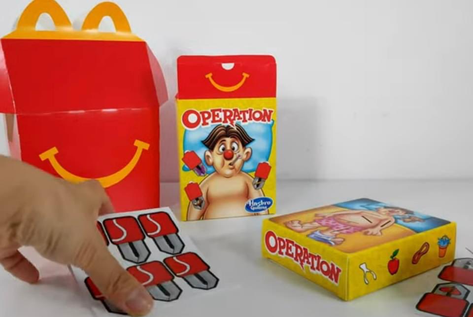 HMooreDesign's tweet photo. The Cavity Sam art I helped Hasbro with has turned up on the World’s Smallest Operation Game, a McDonalds happy meal toy and most recently a Christmas Ornament. #Hasbro #Hasbrogaming #Operation #McDonalds #HappyMeal https://t.co/HIUgi5UAeD