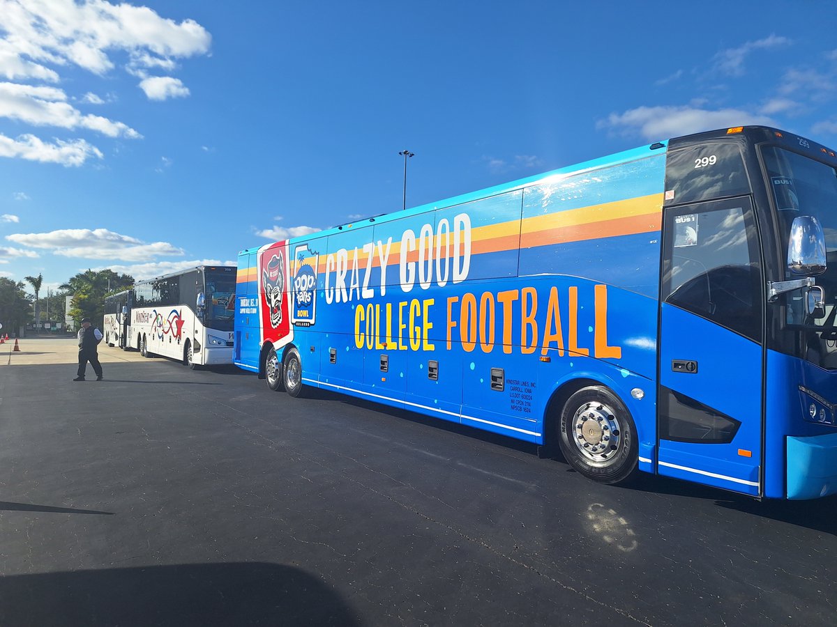 WindstarLines's tweet photo. We've got 8 buses on hand for the Pop Tarts Bowl today in Orlando, and even a fun wrapped one! We are incredibly lucky to be exclusive carriers for many college/university sports teams - and our drivers are always excited to show their team spirit! #GoWindstar #DriveWindstar https://t.co/SBzDXYntBa