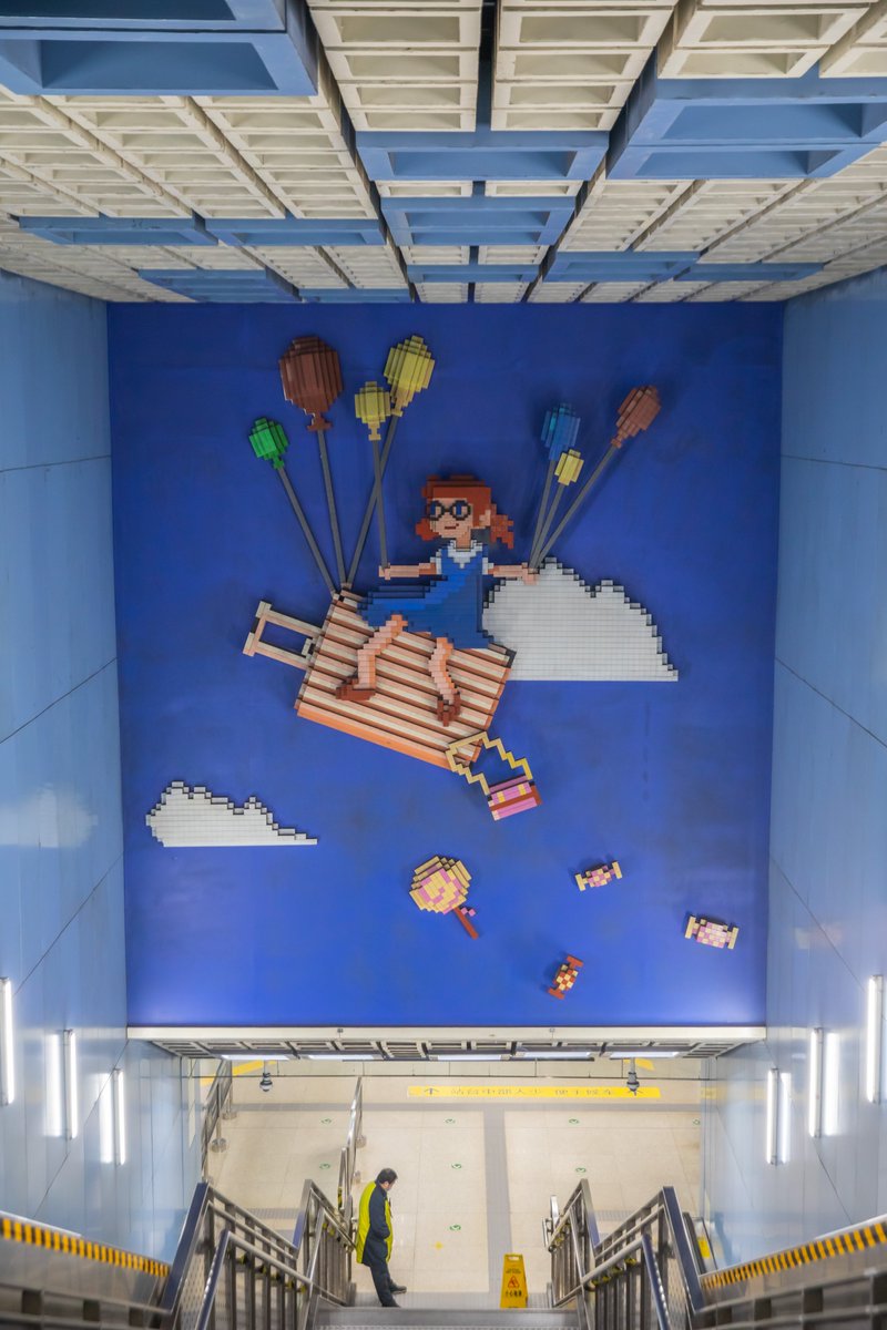 VisitBeijingcn's tweet photo. #Wangjing Station is a pivotal transfer point for #Beijing #Subway Lines 14 and 15. The elevator transfer area captivates with its playful design of #LEGO-like blocks, evoking urban childhood memories. #BeijingMetro #BeijingSubway #VisitBeijing