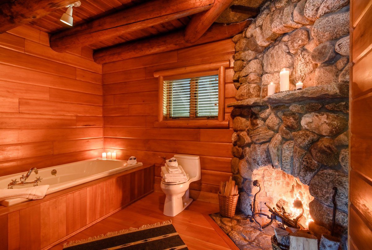 A peek inside the Boathouse Black &amp; Red Rooms. Each offers a master bedroom, a wood-burning #fireplace &amp; bathroom with its own fireplace!  An upstairs bedroom offers a cozy fireplace &amp; lakeview balcony.  A home away from home…#Adirondacks-style. #luxurytravel #upstateny #iloveny